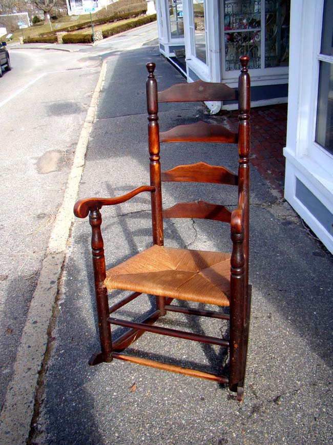 An 18th century New England Ladder back armchair circa 1760 converted to a rocker circa 1800